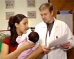a doctor and a mom holding her baby